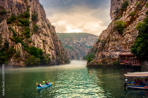 Canyon Matka near Skopje with people kayaking and amazing foggy scenery