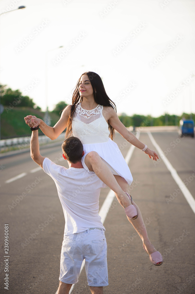 Couple in love - Beginning of a Love Story. A man and a girl dancing on the road. Couple in love - Beginning of a Love Story. A man and a girl dancing on the road.