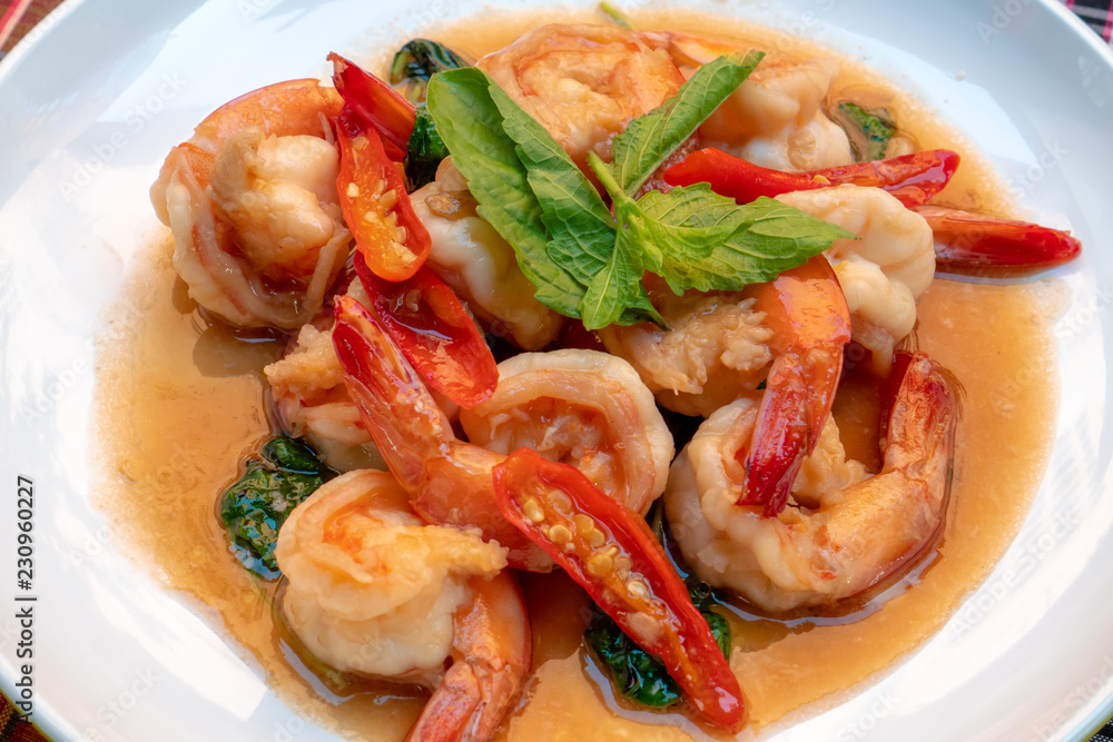Fried shrimps with sweet basil leaves, spicy thai food Fried shrimps with sweet basil leaves, spicy thai food