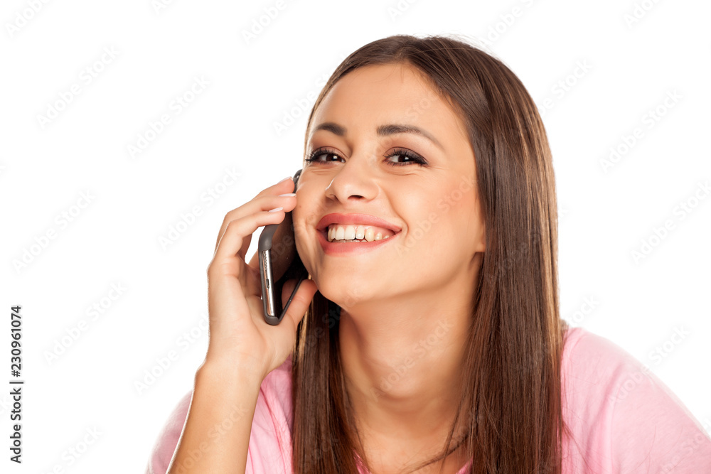 happy young woman talking in her smartphone on white background happy young woman talking in her smartphone on white background