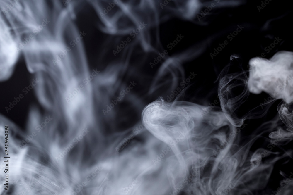 photo of developing smoke from a cigarette on a black background