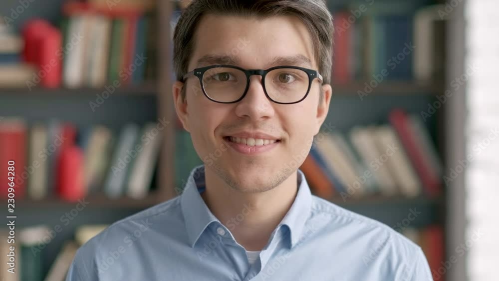 portrait intelligent young asian man student smiling enjoying success looking happy confident male in library bookstore background portrait intelligent young asian man student smiling enjoying success looking happy confident male in library bookstore background