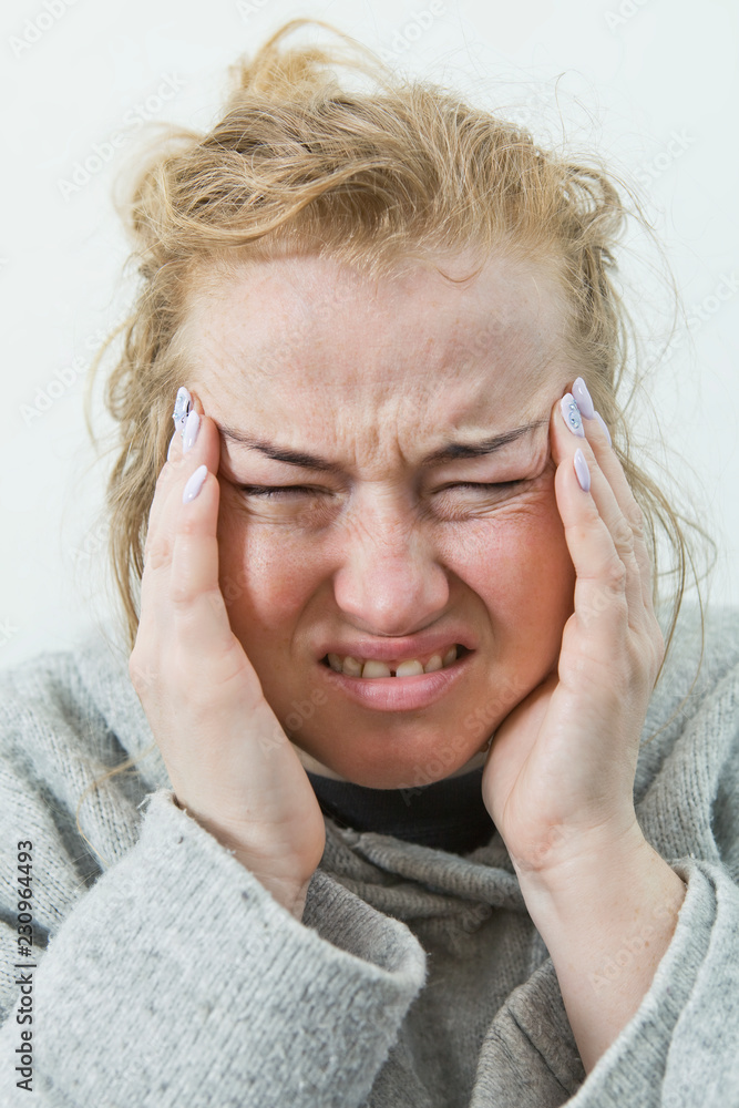 Stressed exhausted young woman having strong tension headache. Stressed exhausted young woman having strong tension headache.