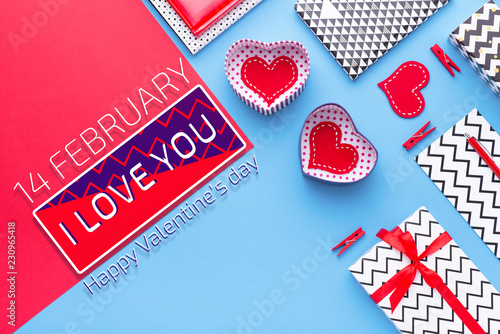 Person holding a present for Saint Valentine's day in his hands. Beautiful colorful background to st. Valentine day. Greeting card with red hearts. Wedding's invitation. Love expression.  photo