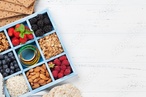 Healthy breakfast set with muesli, berries and milk