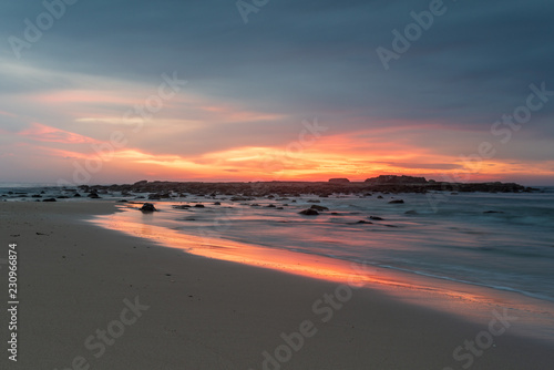 Sunrise at Pretty Beach on the South Coast of New South Wales. Bright colours  sand and surf in Australia.
