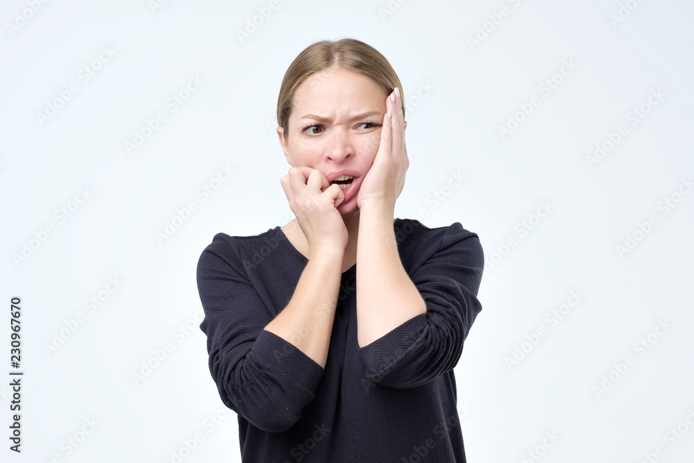 Desperate young caucasian woman is afraid of problems. Strife concept Desperate young caucasian woman is afraid of problems. Strife concept