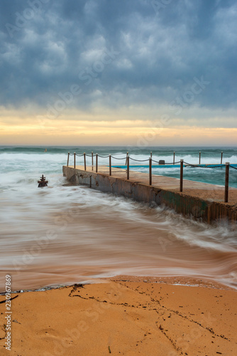 Photography Cloudysunrise at Bilgola Beach. Ocean pool on a cloudy day.