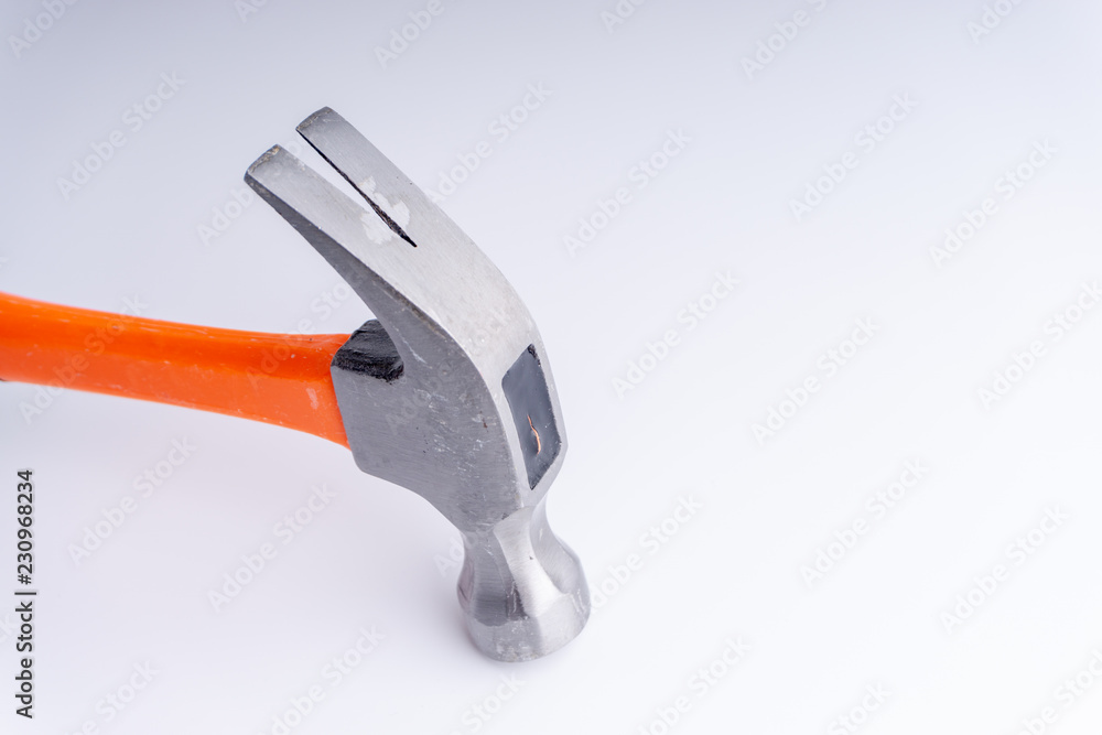 Hammer closeup on white background with selective focus and crop fragment Hammer closeup on white background with selective focus and crop fragment