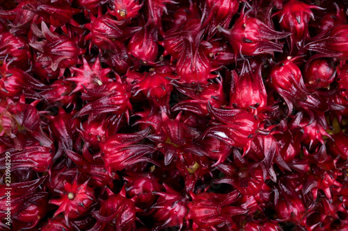 Background and texture of red roselle. Pile of red roselle for make healthy beverage. photo
