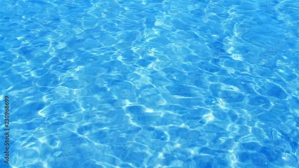 Beautiful refreshing blue swimming pool water Beautiful refreshing blue swimming pool water