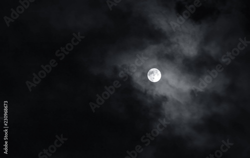 Canvas Print Full moon with dark clouds in the night sky