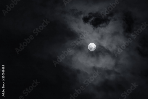 Photography Full moon with dark clouds in the night sky
