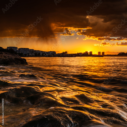 Sunset over Parramatta River  Sydney  Australia. Colour and cloud reflection through the centre of Sydney.