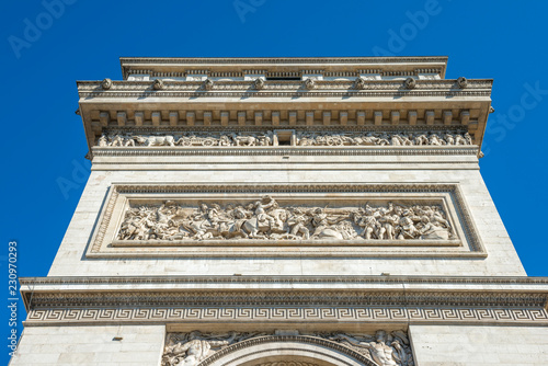 Arc de Triomphe on blue sky in Paris France