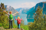 happy little boy and girl travel in nature, family hiking