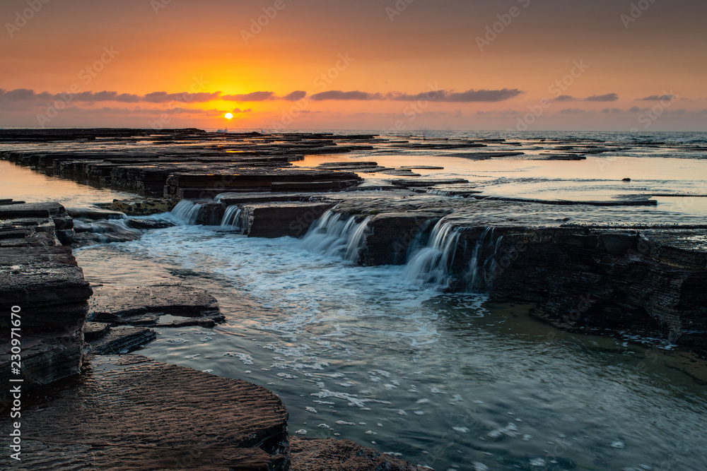 Sunrise at Austinmer Beach, Australia. Morning glow on the South Coast of New South Wales.