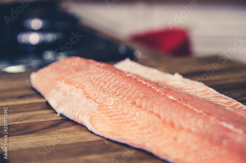 Salmon filet on cutting board.