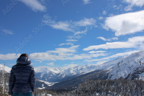 Young woman watching Swiss National Park in wintertime, Switzerland