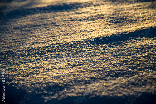 Snow at sunrise as an abstract background