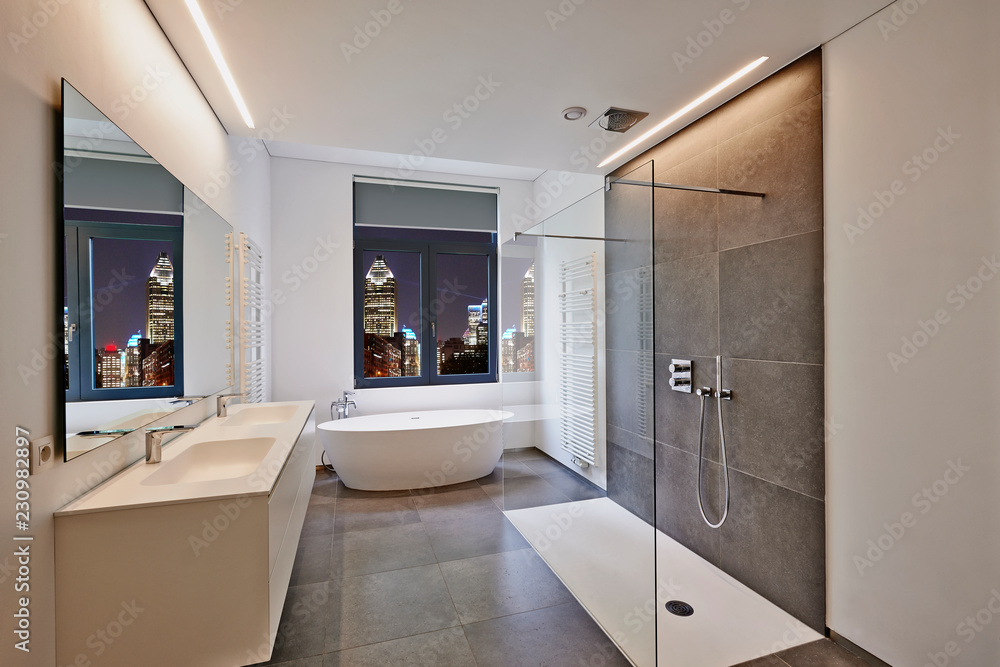 Bathtub in corian, Faucet and shower in tiled bathroom