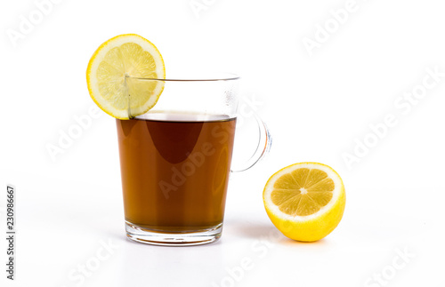 Lemon tea, cup with lemon tea and fresh lemon isolated on white background