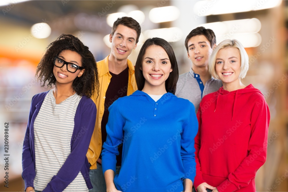 Group of Students with books isolated on background Group of Students with books isolated on background