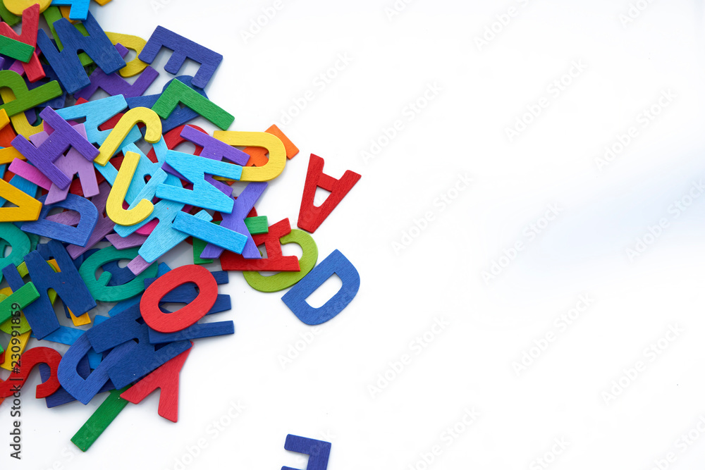 Pile of colorful wooden letters isolated over the white background with copyspace Pile of colorful wooden letters isolated over the white background with copyspace