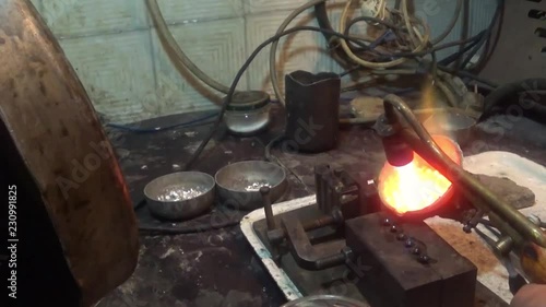 jeweler melts metal