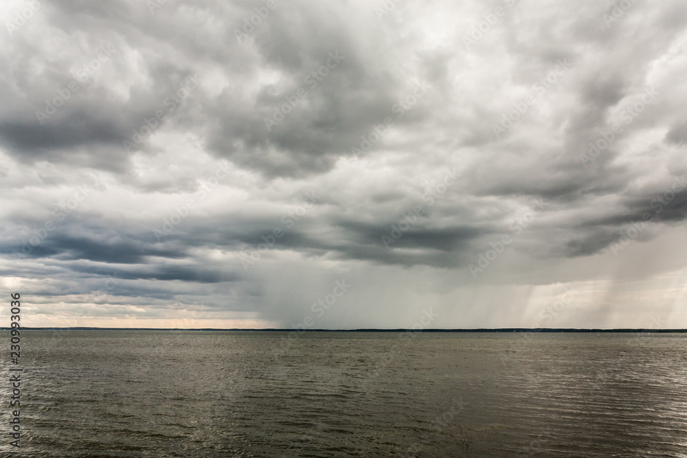 Bad weather with clouds and rain on a lake in Masuria, Poland