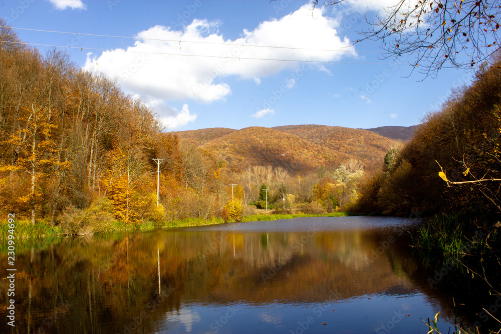 Lake Grza near the Paracin town. Pond with weird reflection in autumn, sunny day