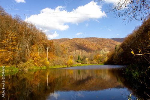 Lake Grza near the Paracin town. Pond with weird reflection in autumn, sunny day