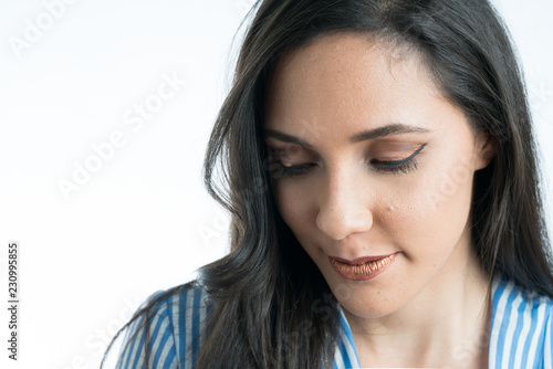 Woman's face close up, looking down