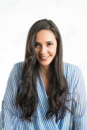 Woman smiling with head turning down