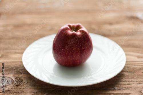 red Apple on a white plate