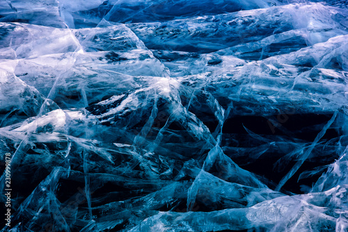 Blue cracked surface of the ice surface