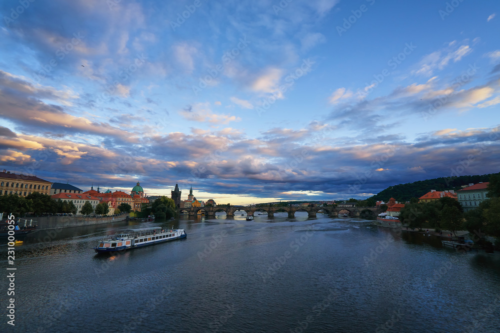 Famous Prague Charles bridge across Vltava river with ships famous European Czech republic landmark beautiful panorama view