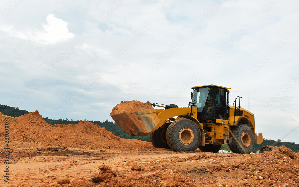 Excavators filled with earth works in Asia