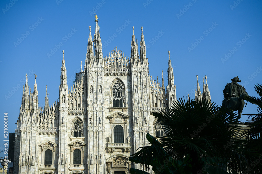 The Duomo Cathedral in Milan, Italy with the newly planted palm trees and the equestrian statue of Vittorio Emanuele II The Duomo Cathedral in Milan, Italy with the newly planted palm trees and the equestrian statue of Vittorio Emanuele II