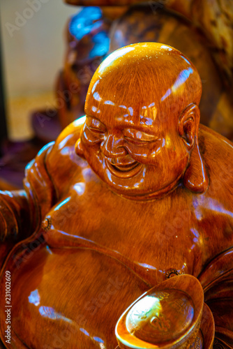 Phra sangkatchai monk statue made from wood in Hyuaplakang temple photo