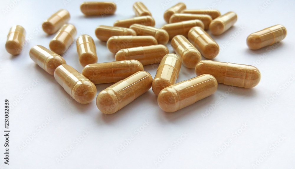 Pharmaceutical medicine capsules on white background. Pharmacy theme, health care, drug prescription for treatment medication and pharmaceutical medicament Pharmaceutical medicine capsules on white background. Pharmacy theme, health care, drug prescription for treatment medication and pharmaceutical medicament