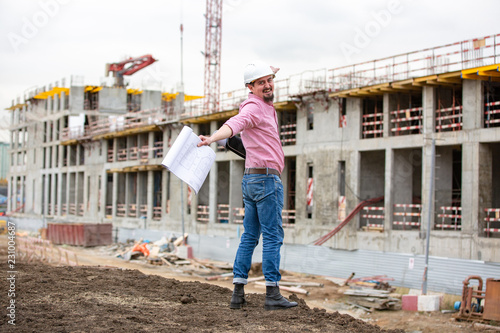 Fotografi Architect at a construction site celebrate after construction project was succes