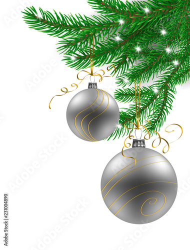 Fir branches decorate with silver and golden Christmas baubles on white background with space for text.