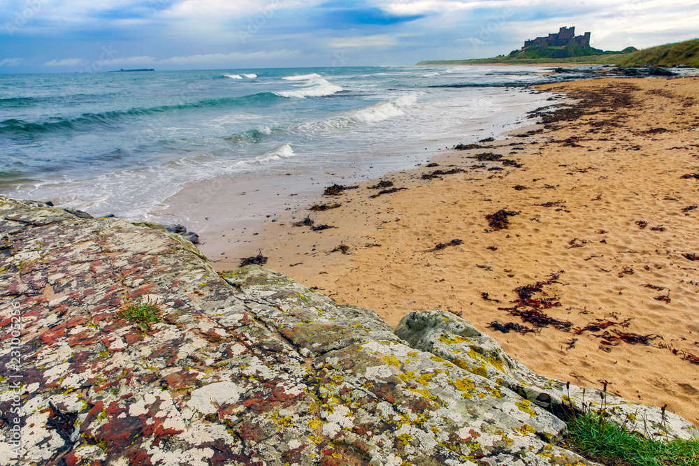Views of  bamburgh beach castle and lighthouse