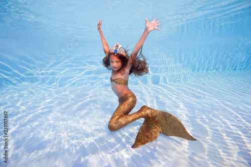 Girl in a mermaid costume poses underwater in a pool, Odessa, Ukraine, Europe photo