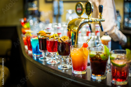 A Set of the Different Kind of Alcoholic Cocktails in the Bar at the Evening Party © toyechkina