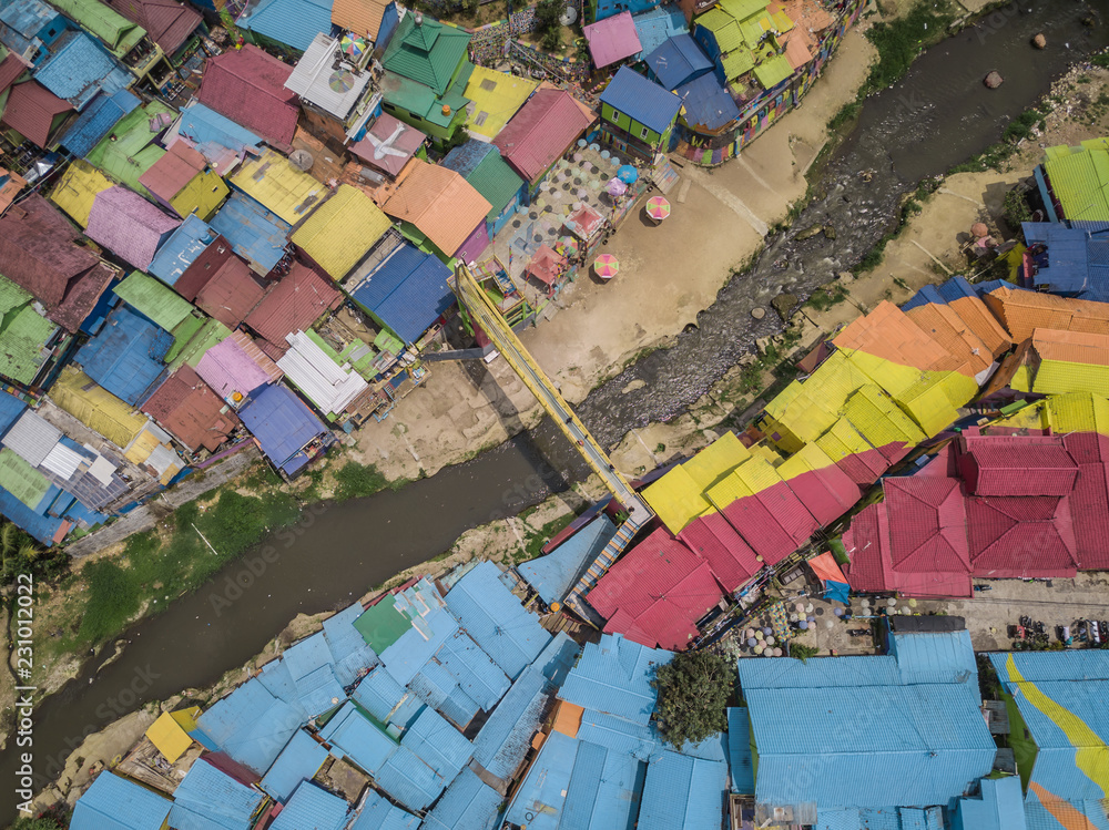 River cuts through the middle of the rainbow village in Malang, Indonesia