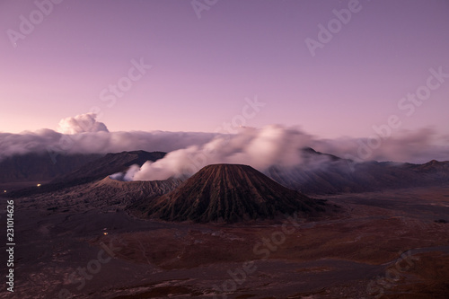 Sunrise over the Mount Bromo caldera with a smokey volcano in East Java  Indonesia