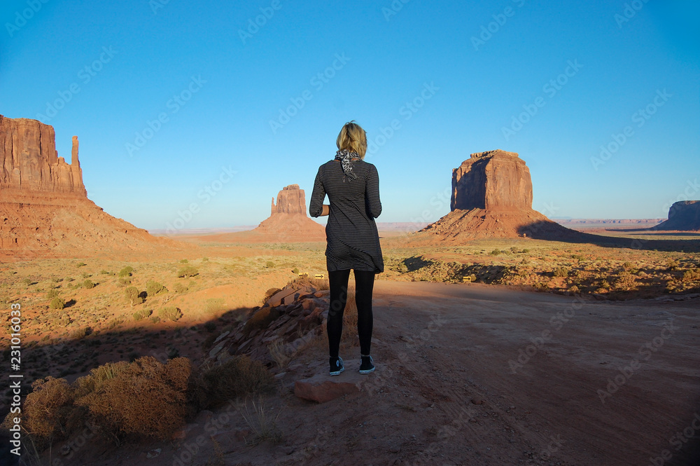 Woman in desert looking in to the distance