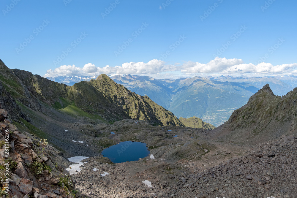 Lake of Reguzzo 2485 m. and the Donati refuge in the Orobie Valtellina Alps